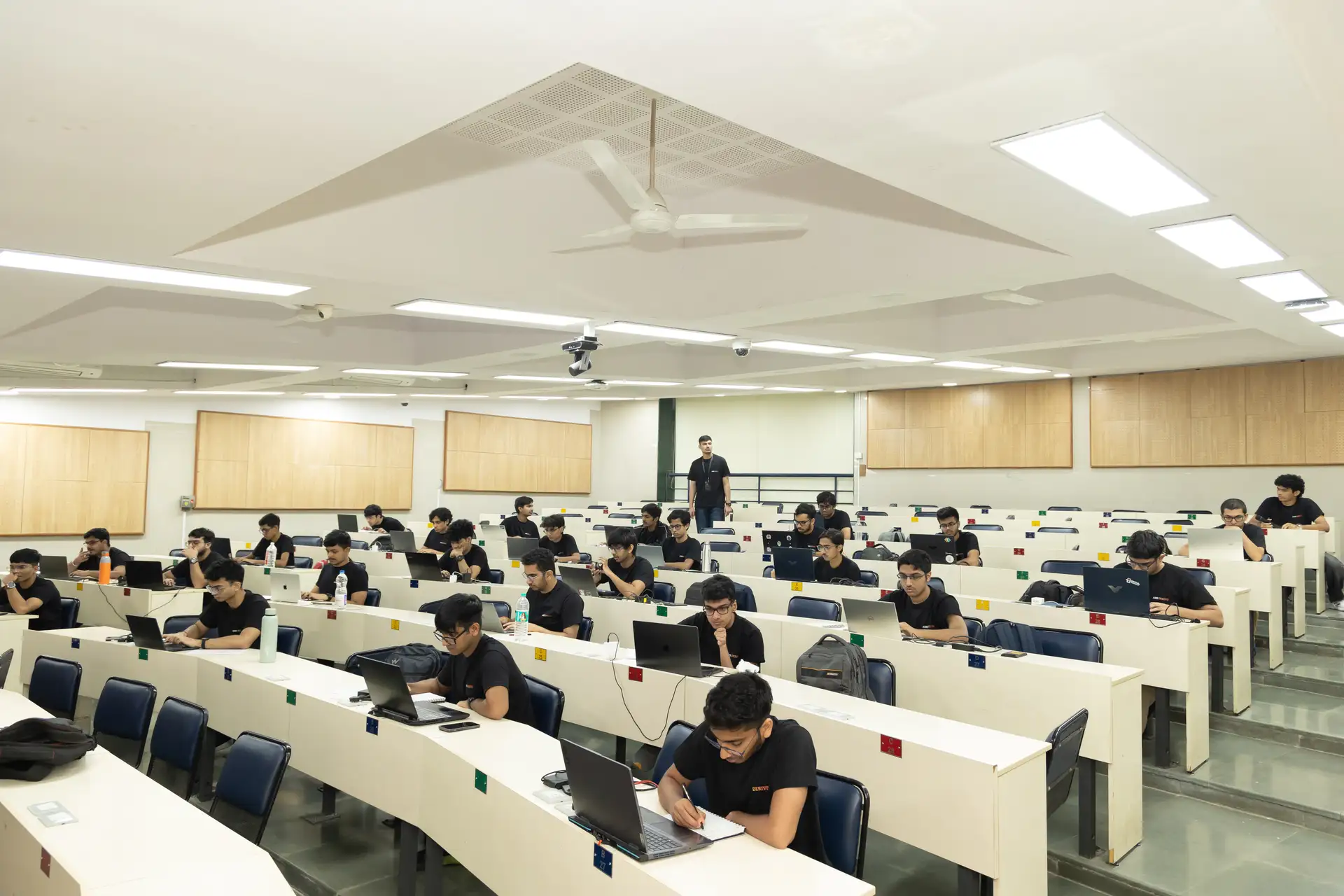 Finalists working through the problem set in the hall at IIT Bombay, Derive '26 finals