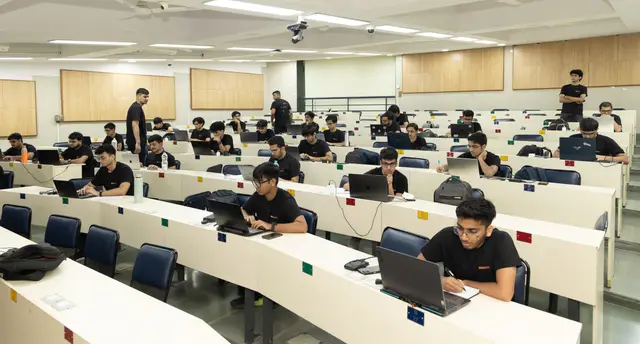 Contestants working in a full lecture hall during the Derive finals at IIT Bombay