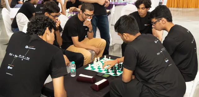 Blitz chess huddle at the evening social